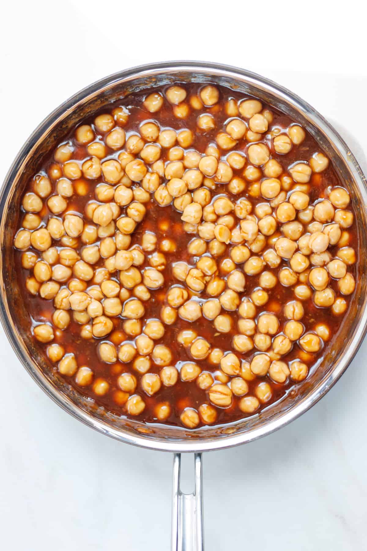 Chickpeas mixed in with the thickened sesame sauce.
