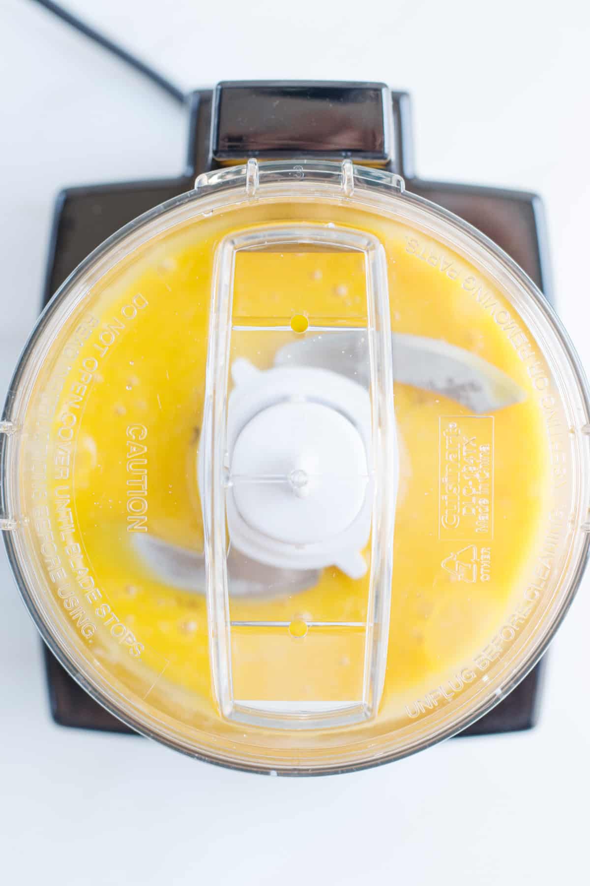 Egg yolks mixing in a food processor.