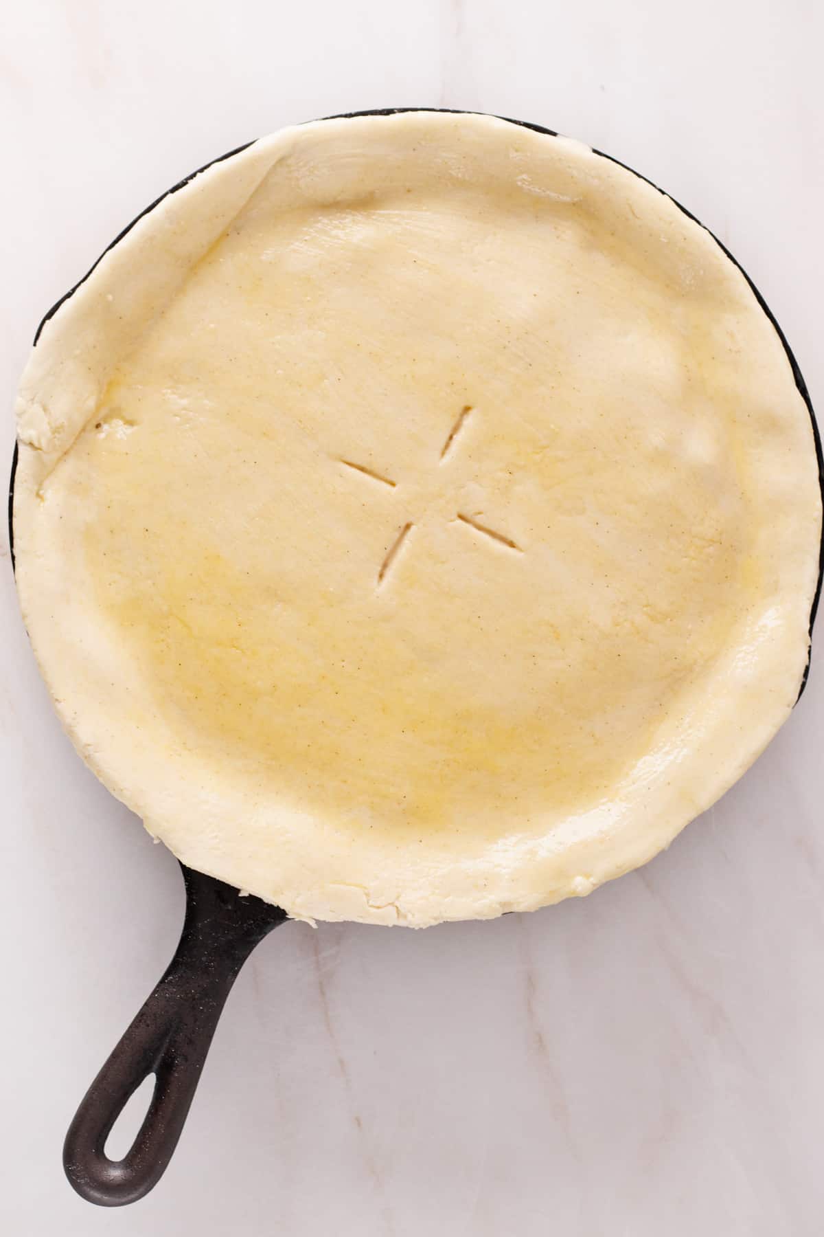 Dairy-free chicken pot pie with egg wash over the crust.