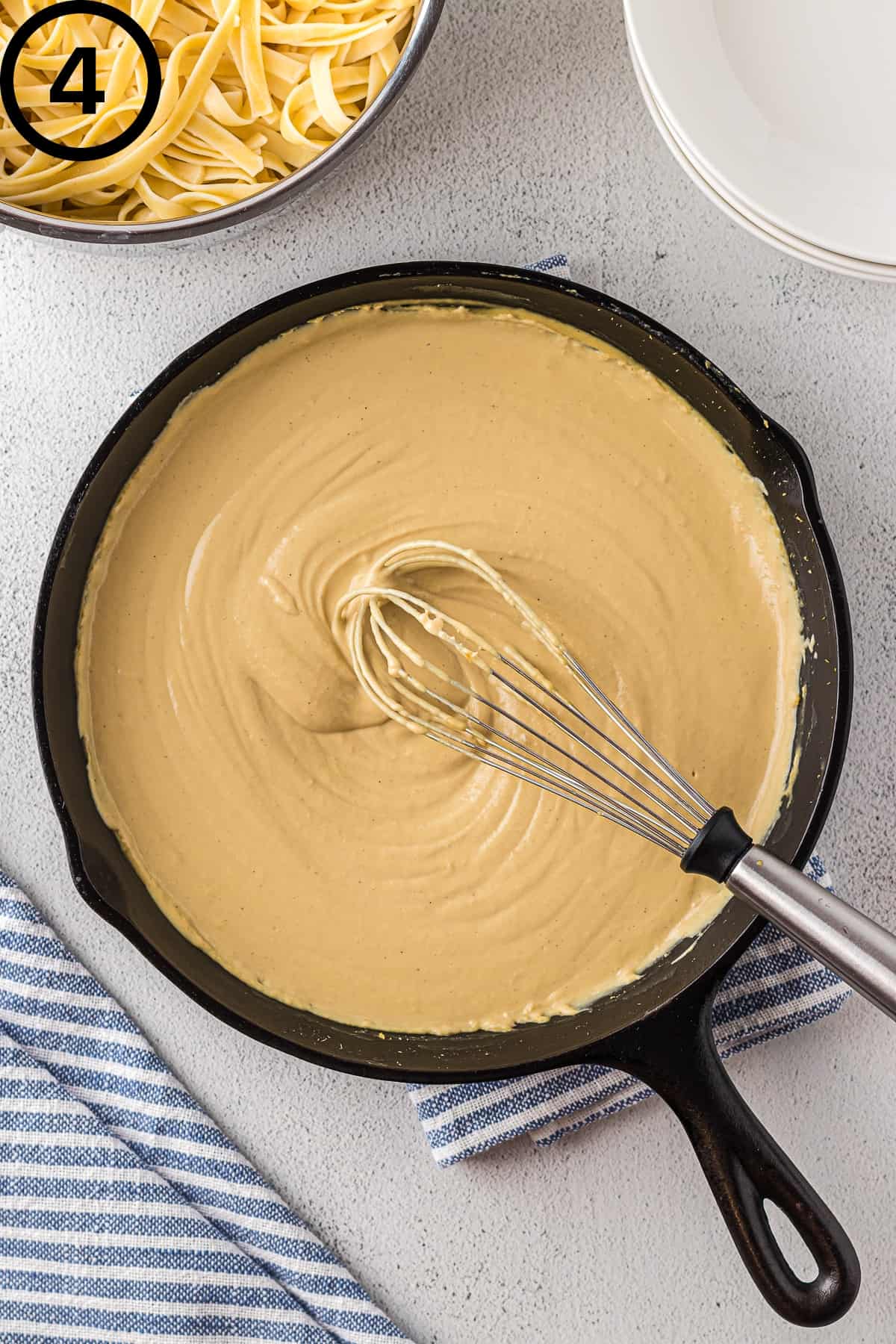 Dairy-free Alfredo sauce in a skillet.