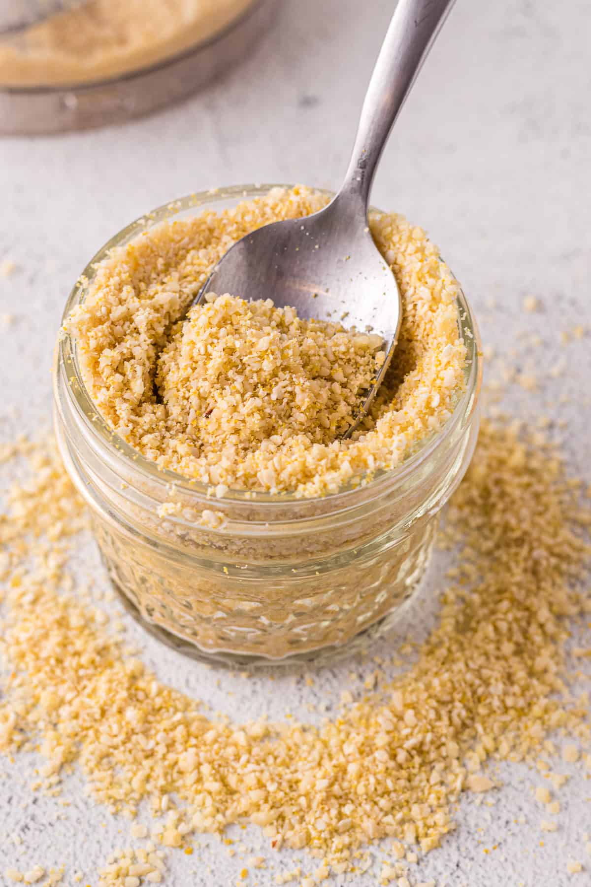 Dairy-free parmesan in a glass jar.