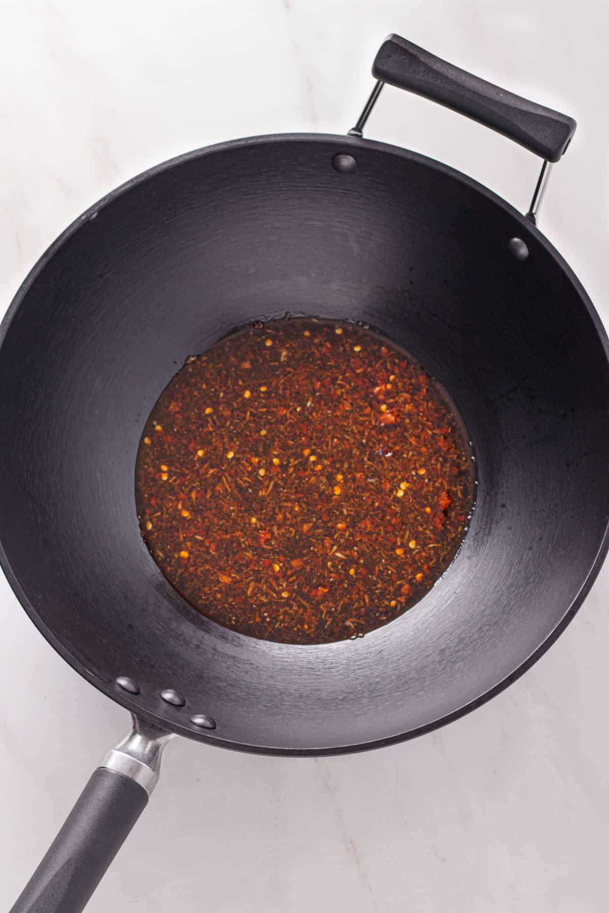 Soy sauce mixture in a wok.