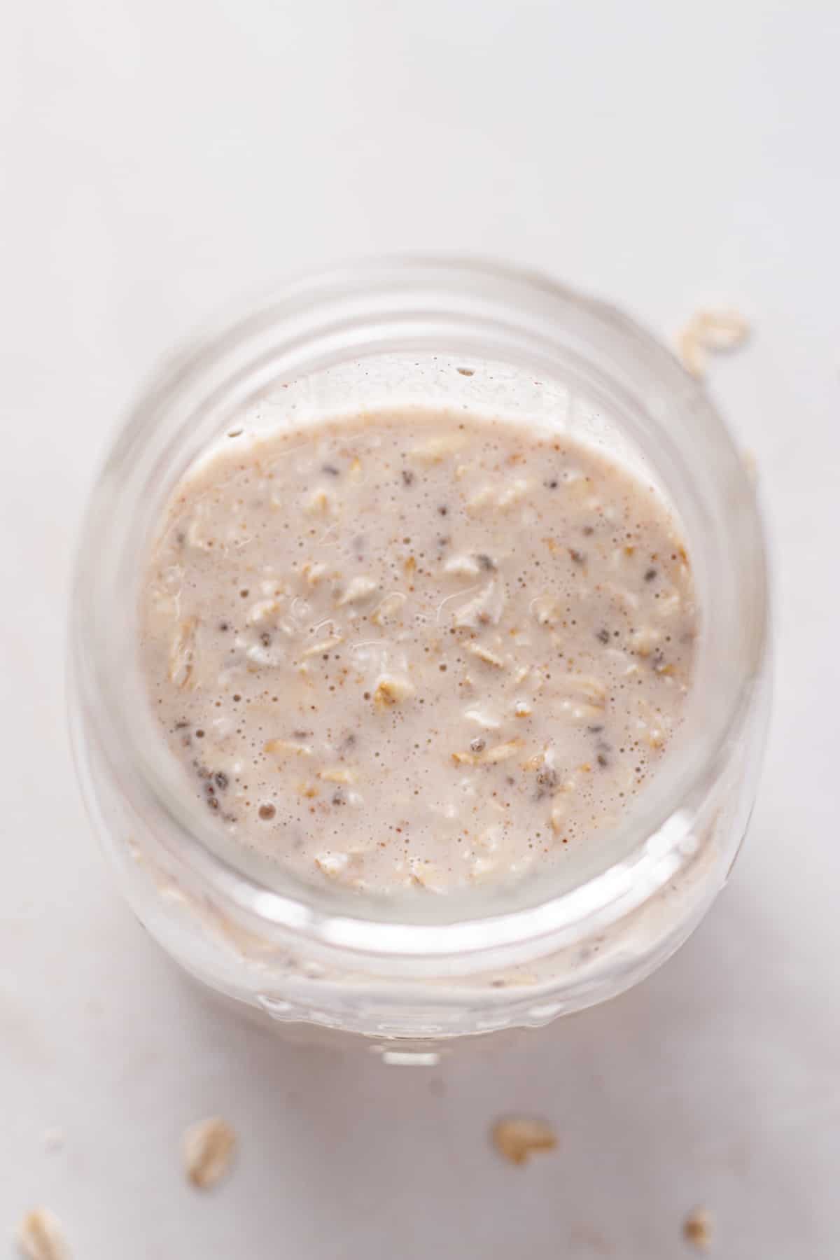 Overnight oats in a mason jar before going in the refrigerator.