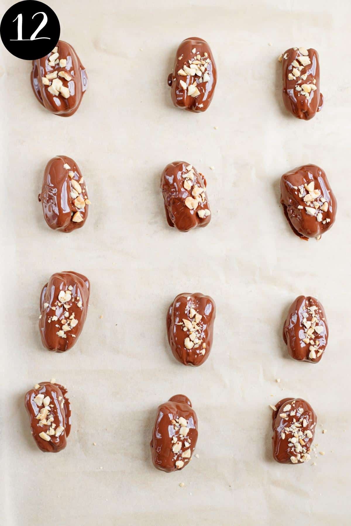 Snicker dates on brown parchment paper before freezing.