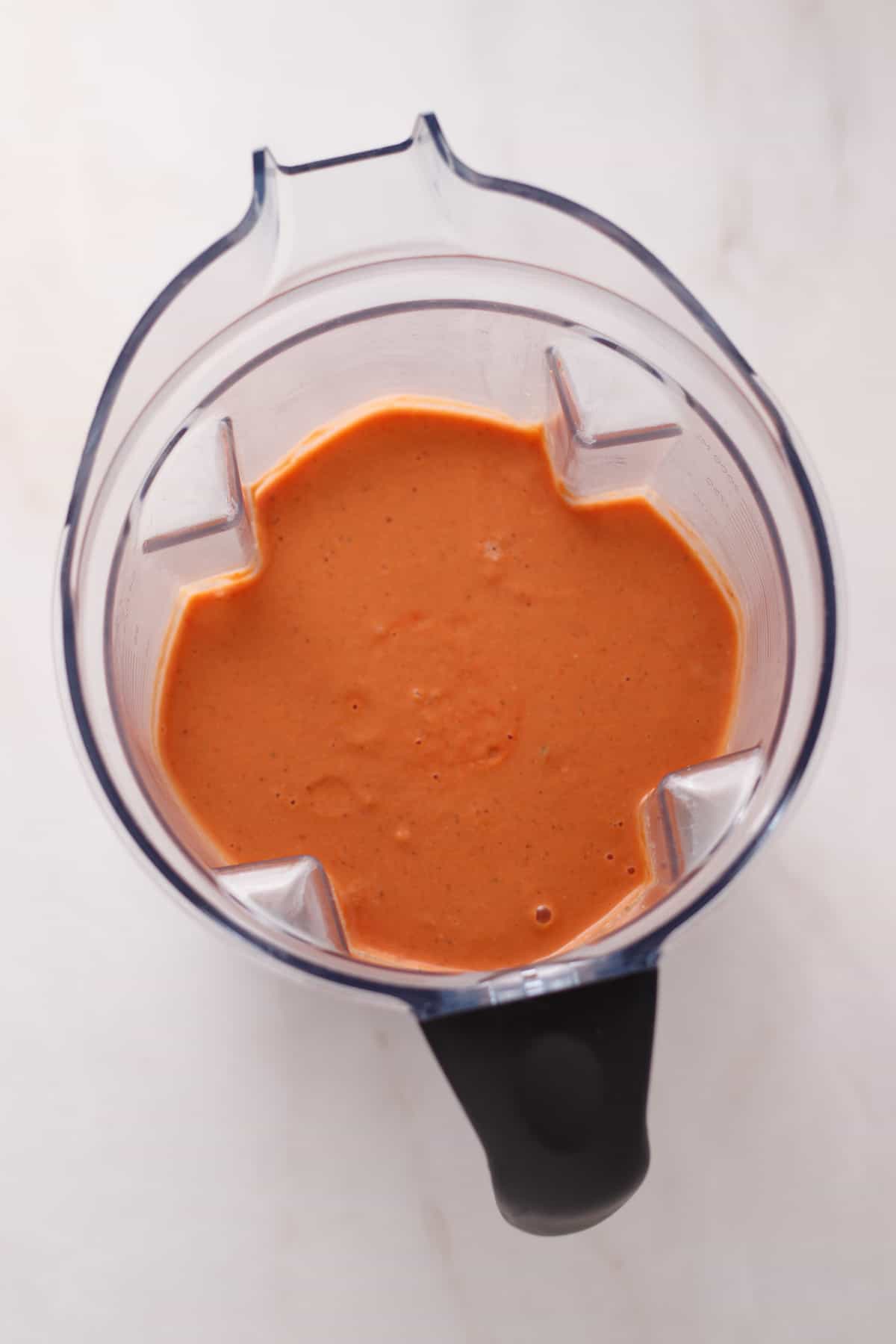 Vegan tomato soup blended in a vitamix blender.