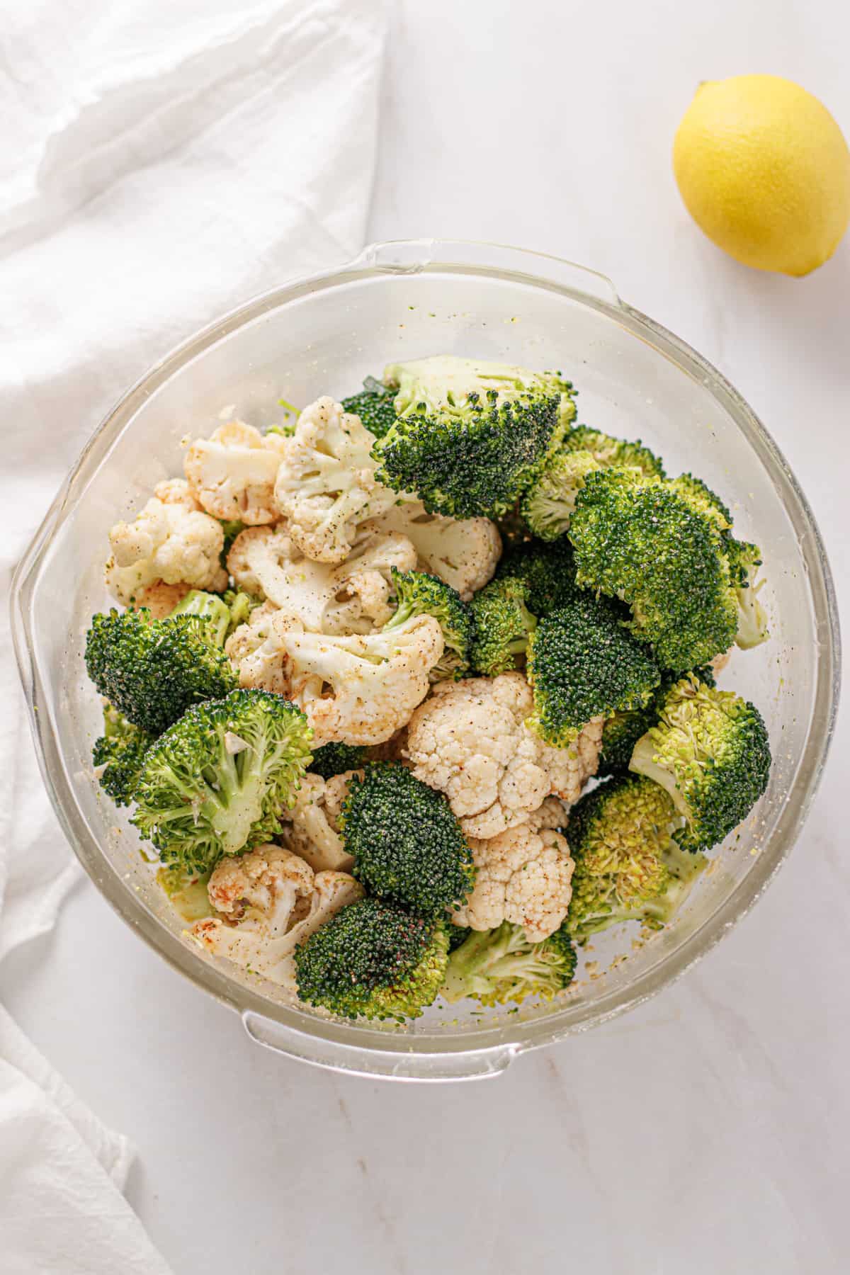 Broccoli and cauliflower mixed with oil and seasonings.