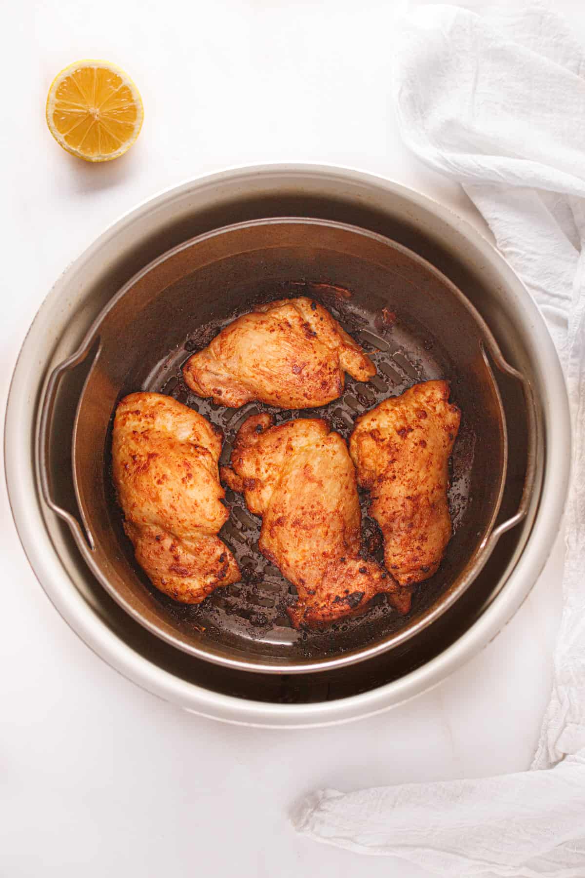 Cooked chicken thighs in the air fryer.