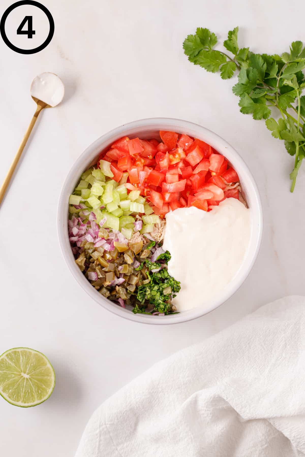 Mexican tuna salad ingredients in a bowl.