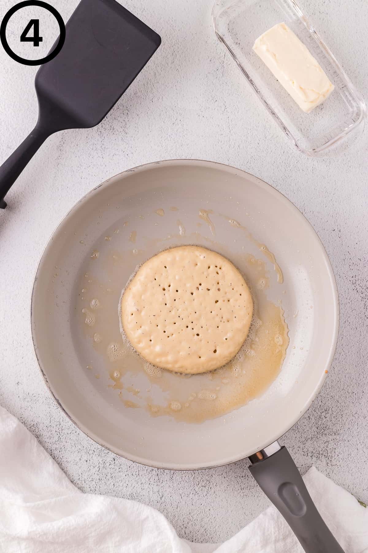 Oat milk pancake that is ready to be flipped.