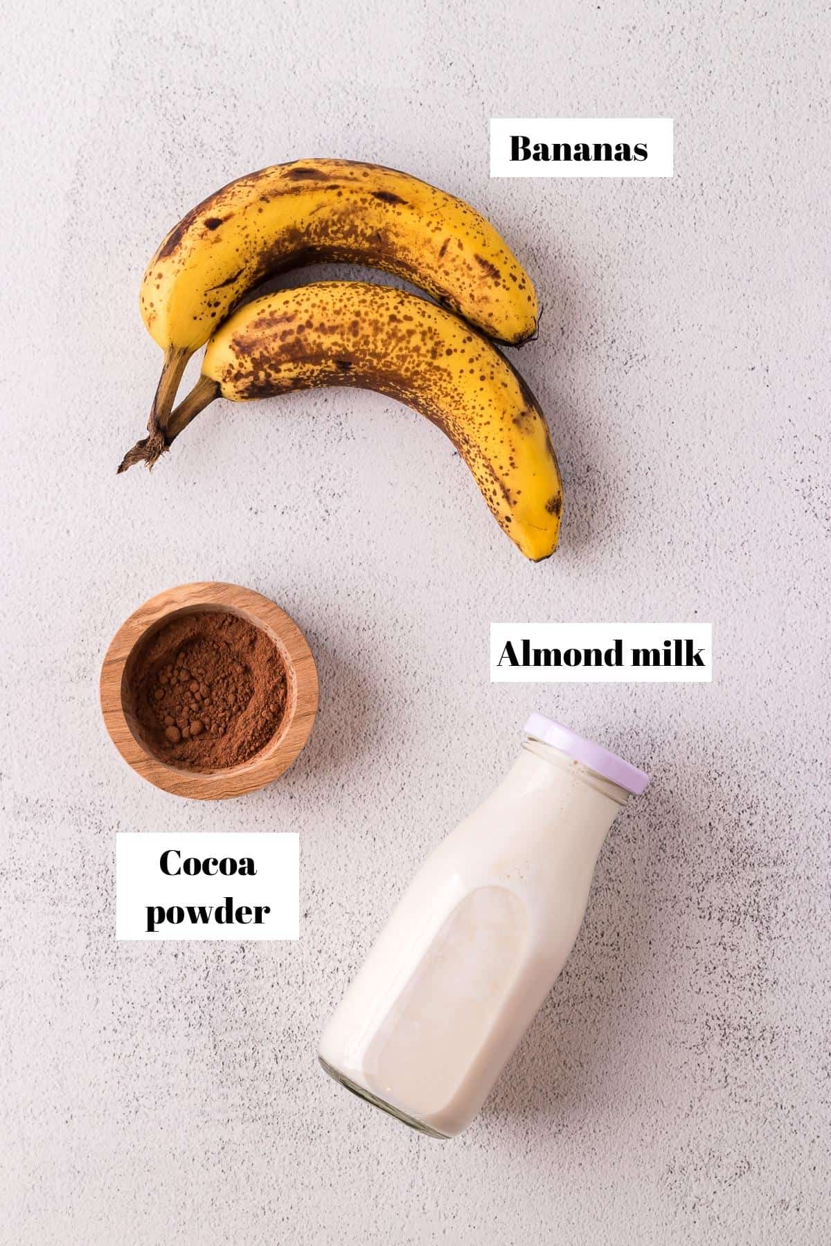 Ingredients to make a chocolate banana milkshake.