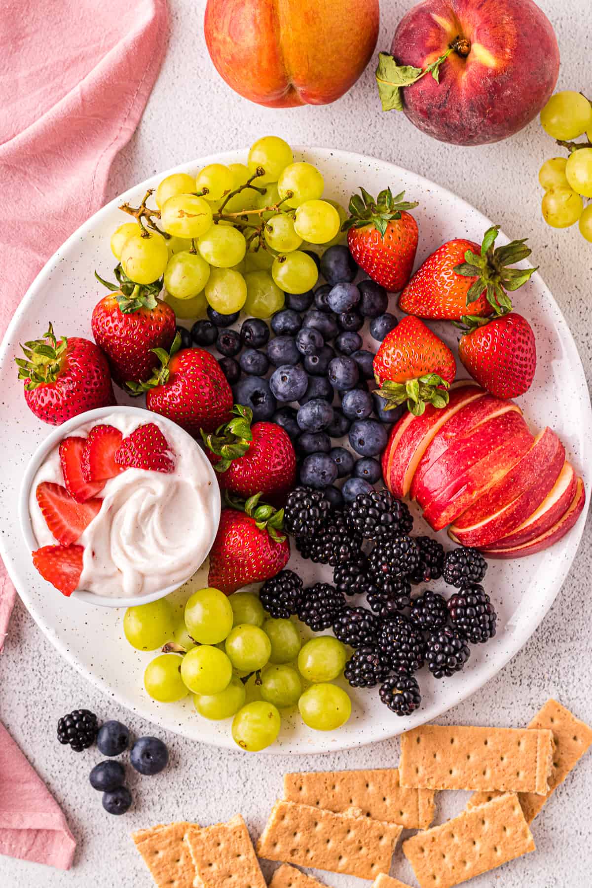 Vegan fruit dip with a plate of fruit.
