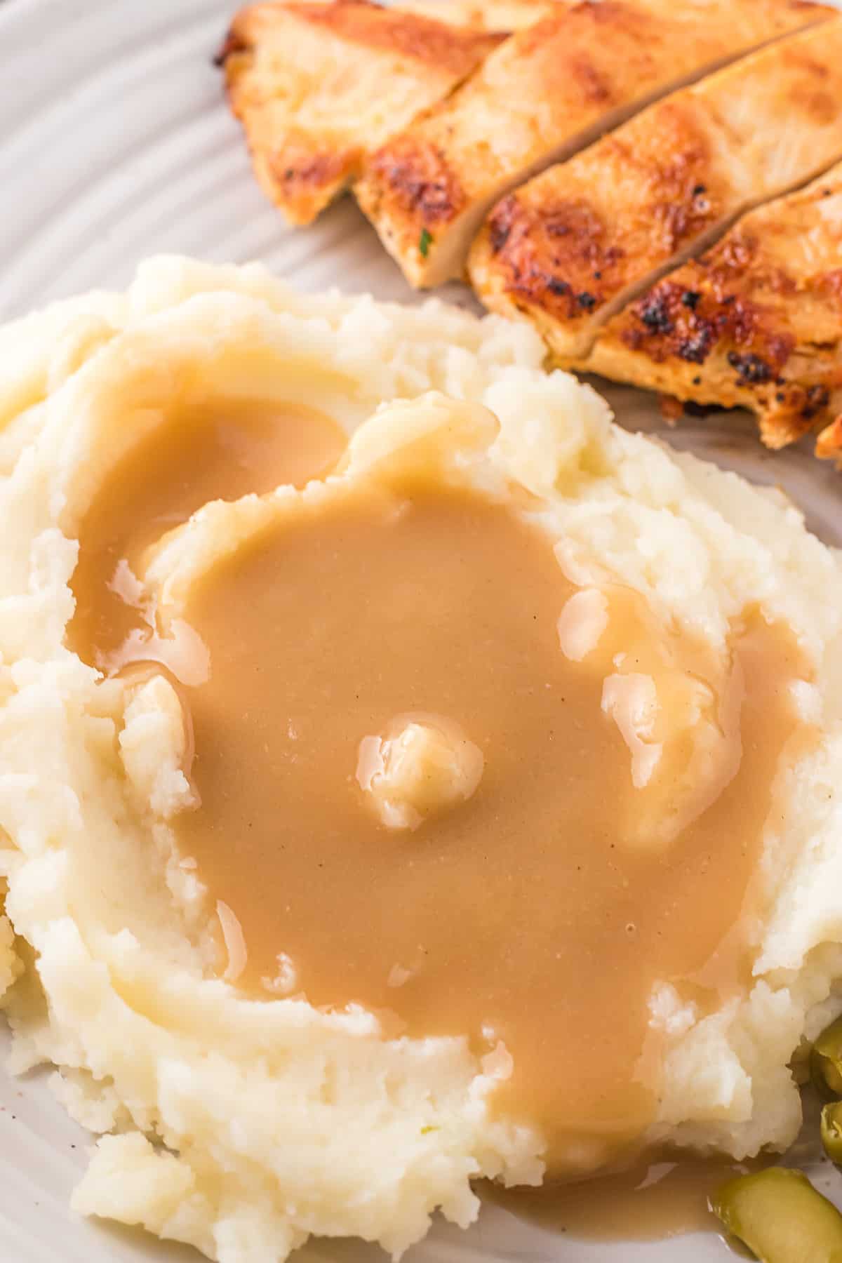 Mashed potatoes with dairy-free brown gravy.