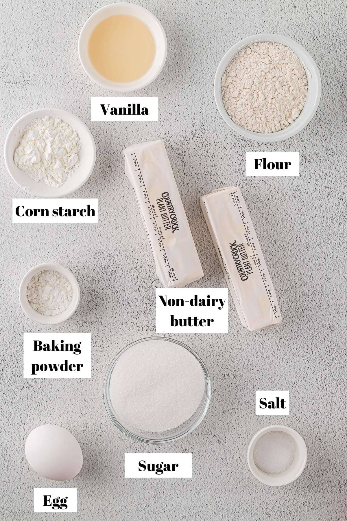 Ingredients to make dairy-free sugar cookies. Text on image for labeling ingredients.