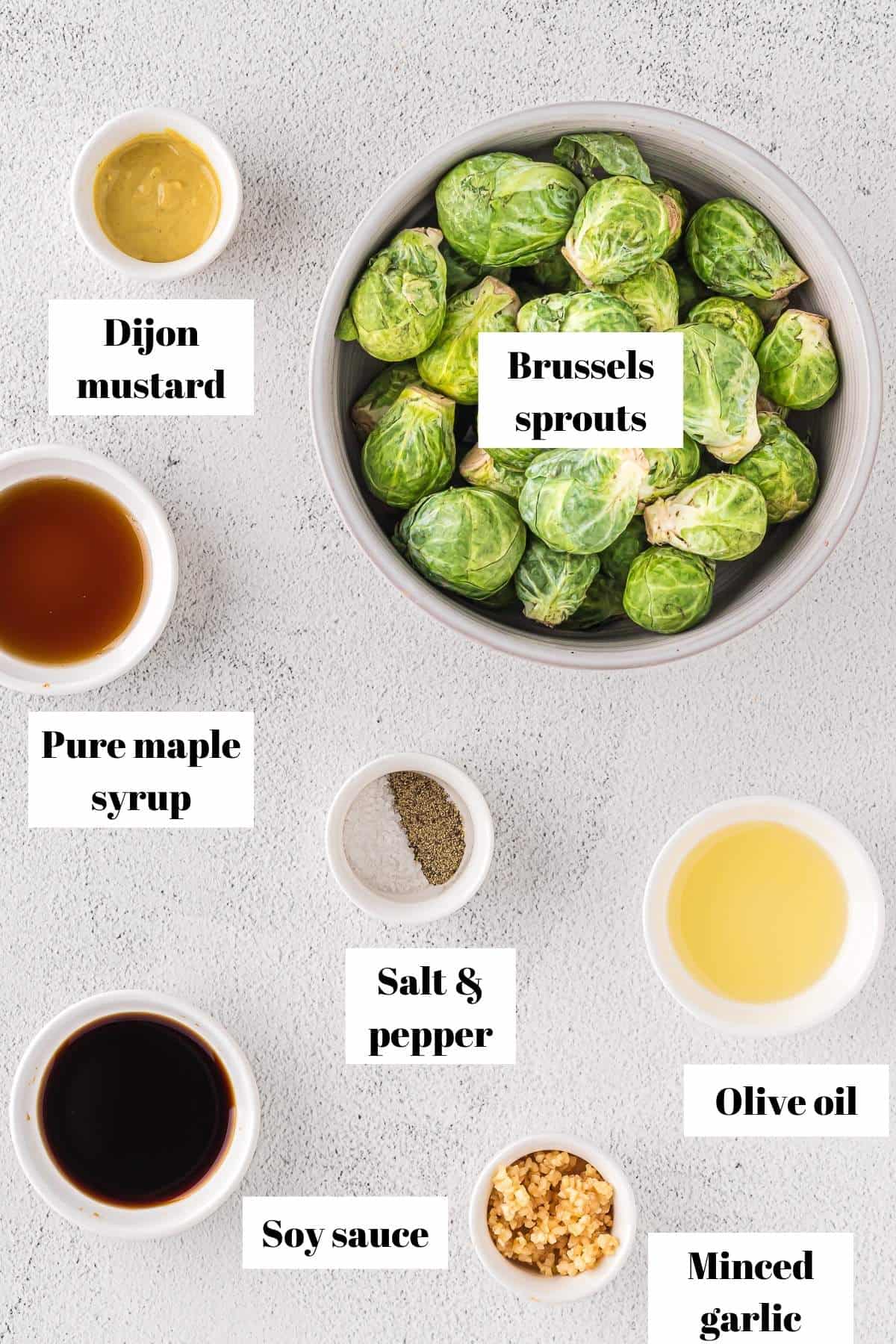 Ingredients to make marinated Brussels sprouts. Text on image for labeling ingredients.