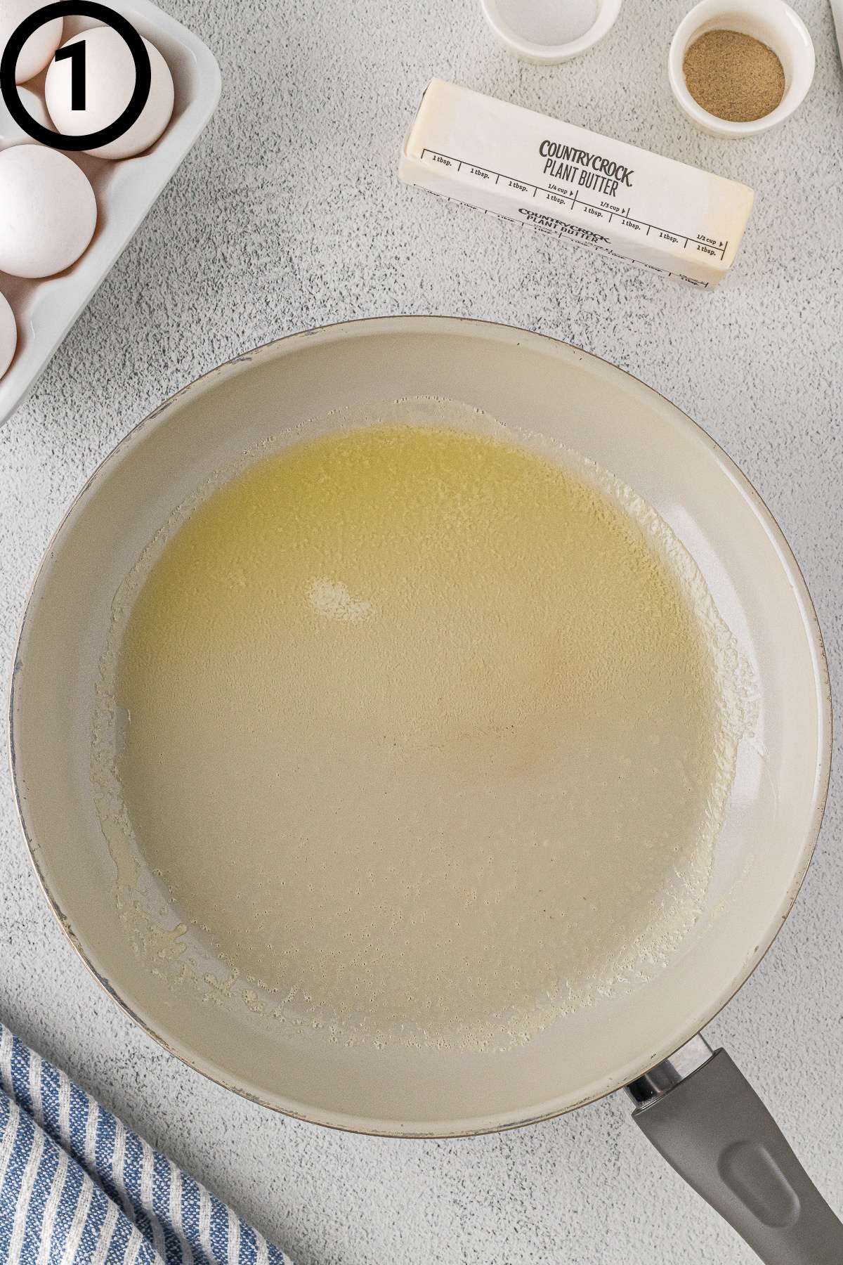 Melted butter in a non-stick pan.