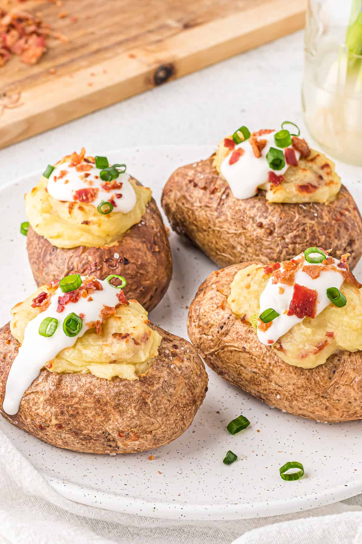 Dairy-free twice baked potatoes on a white plate.