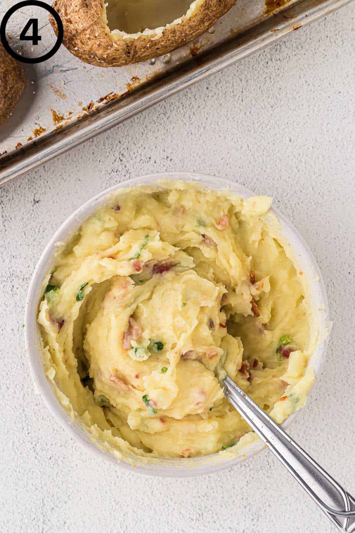 Potato mixture in a white bowl.