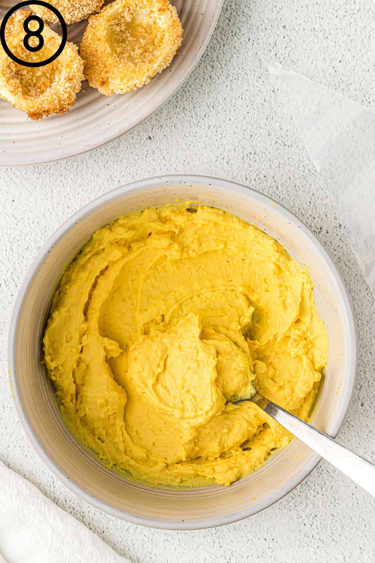 Deviled egg filling in a bowl.