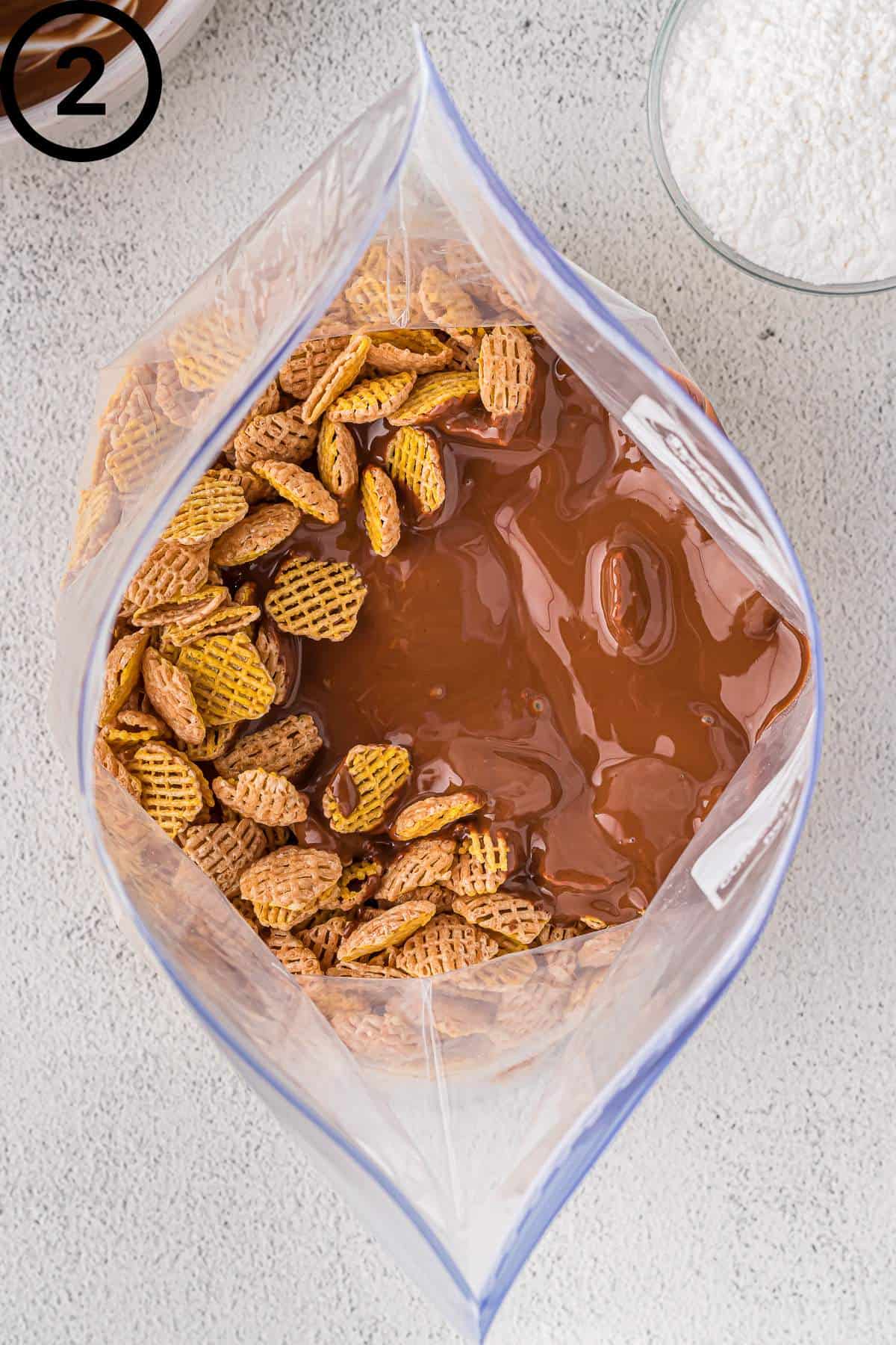 Melted peanut butter and chocolate poured over the Crispix.