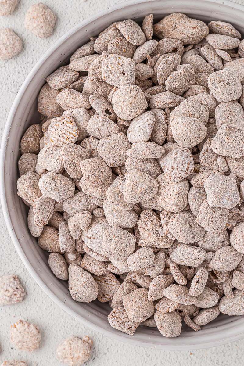 Puppy chow in a white bowl.